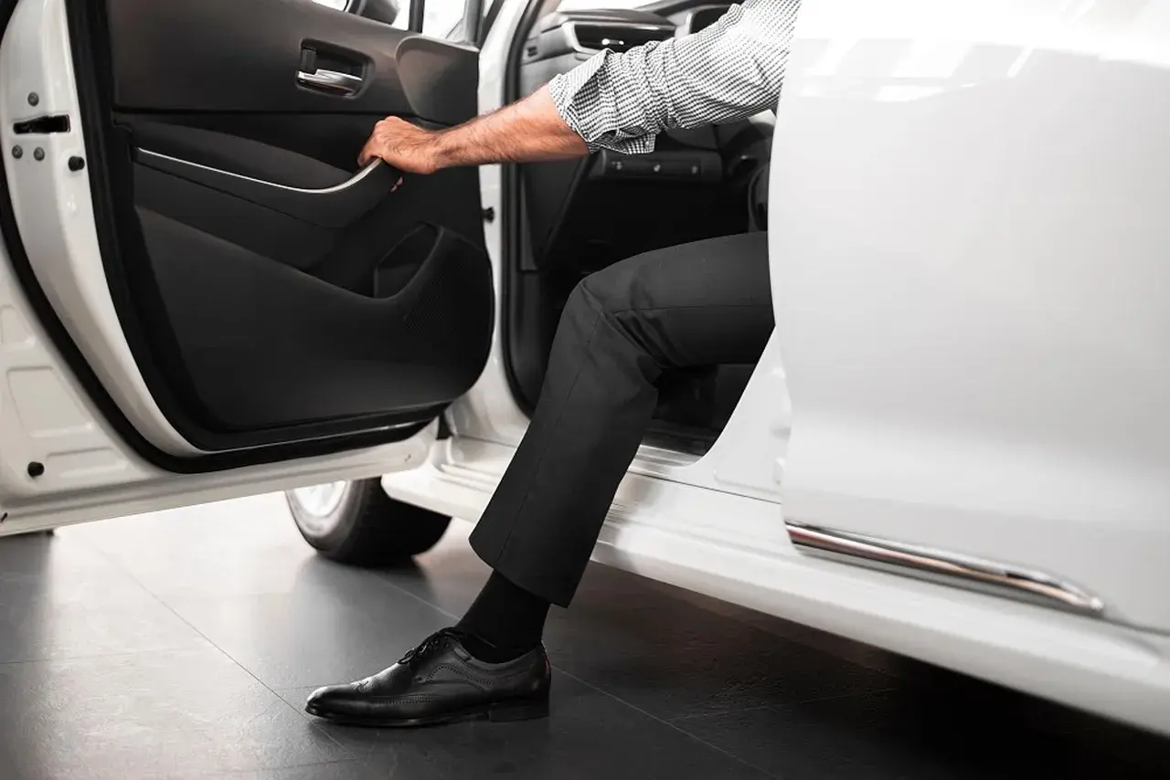 A person getting out of a car A person getting out of a car